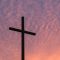 silhouette of large cross during daytime