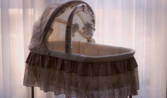 baby's white and black bassinet